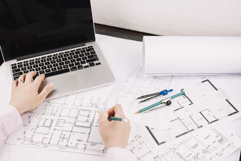 architecture-concept-with-building-plan-laptop
